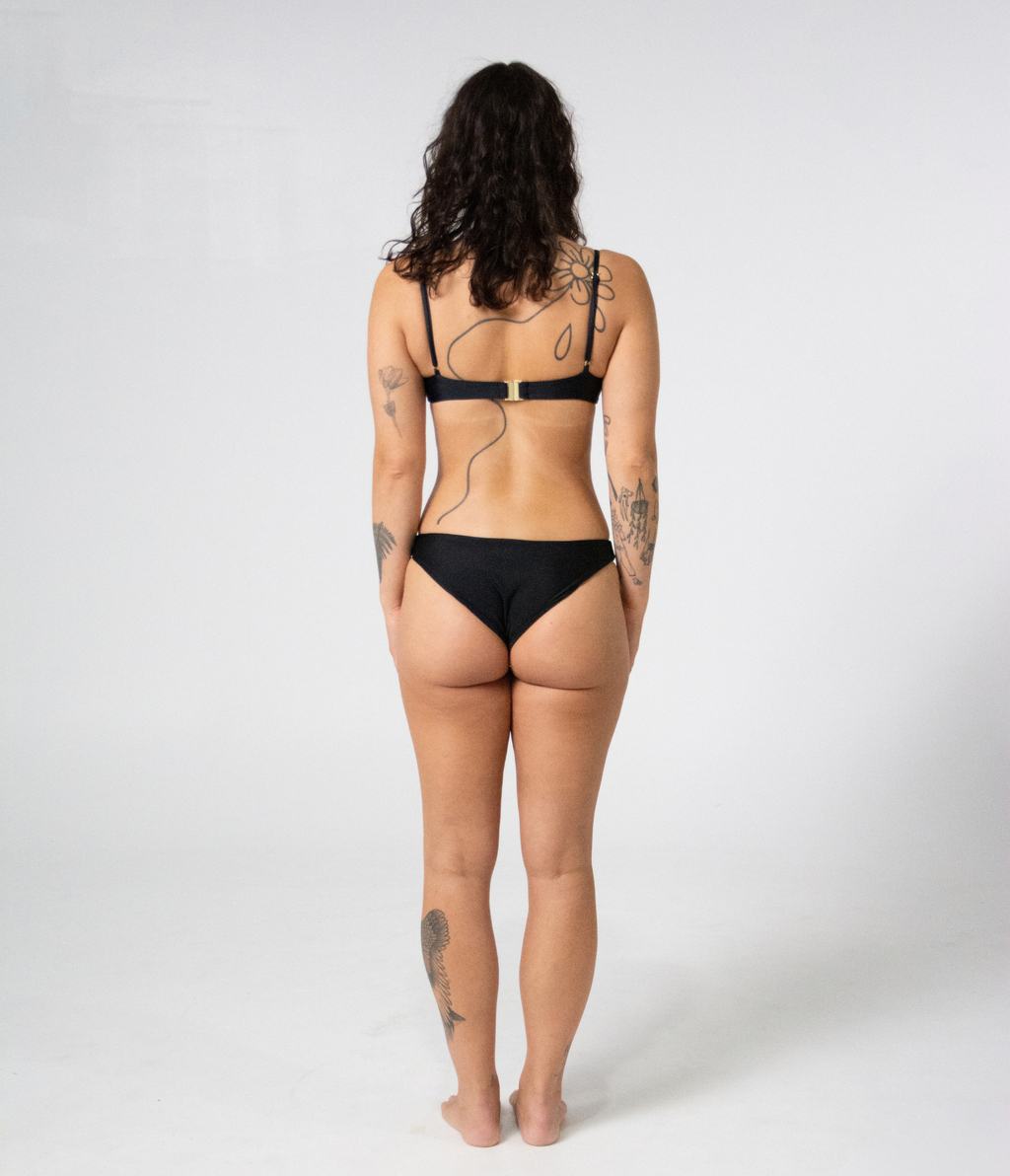 Byron Low Rise Bottoms in Noir (black), back view on model showing full coverage