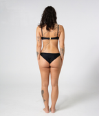 Byron Low Rise Bottoms in Noir (black), back view on model showing full coverage