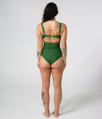 Noosa One Piece in Fern (green), back view on model showing the cutout back and gold buckle