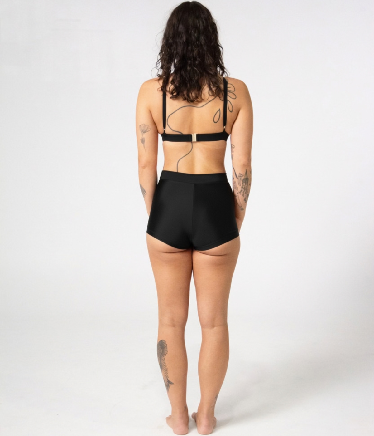 Kirra Triangle Top in Noir (black), back view on model showing the tie straps