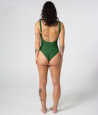 Mali One Piece in Fern (green), back view on model showing the scoop back and gold strap hardware