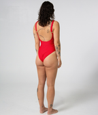 Mali One Piece in Scarlet (red), right rear three-quarter view on model