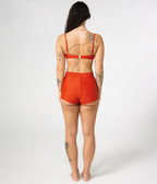 Wategos Underwire Top in Rust (orange), back view on model