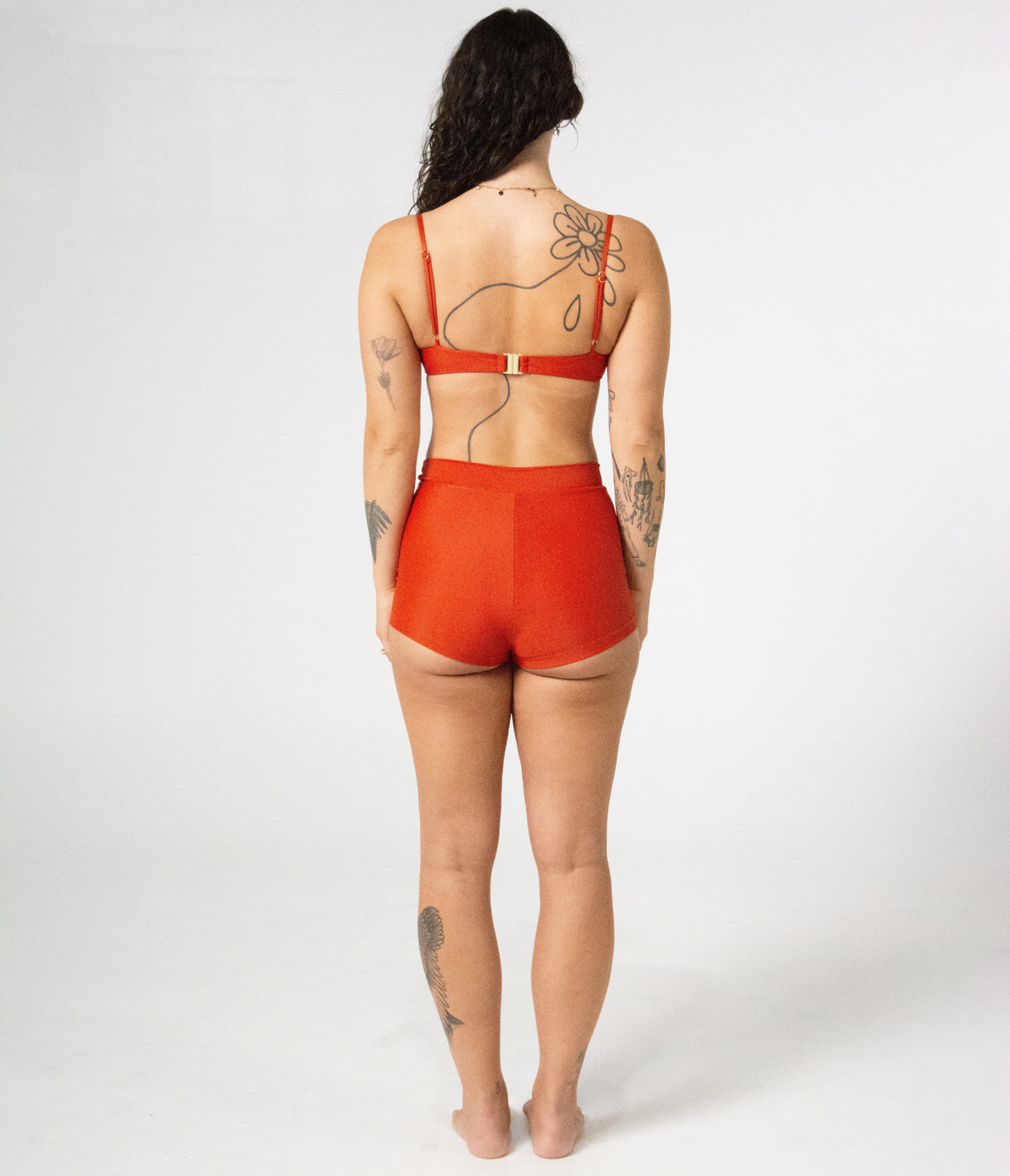 Wategos Underwire Top in Rust (orange), back view on model