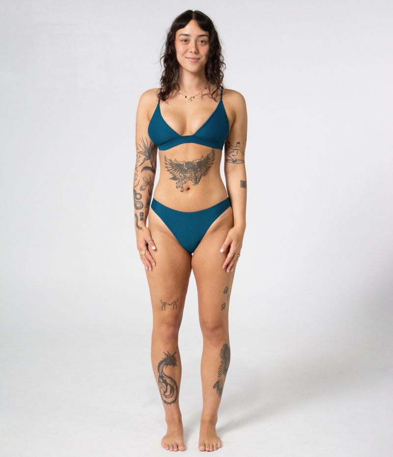 Byron Low Rise Bottoms in Peacock (teal), front view on model
