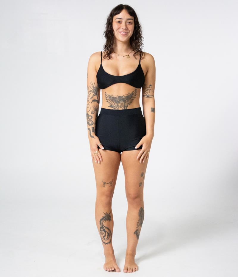 Crescent Scoop Top in Noir (black), front view on model showing the scoop neckline