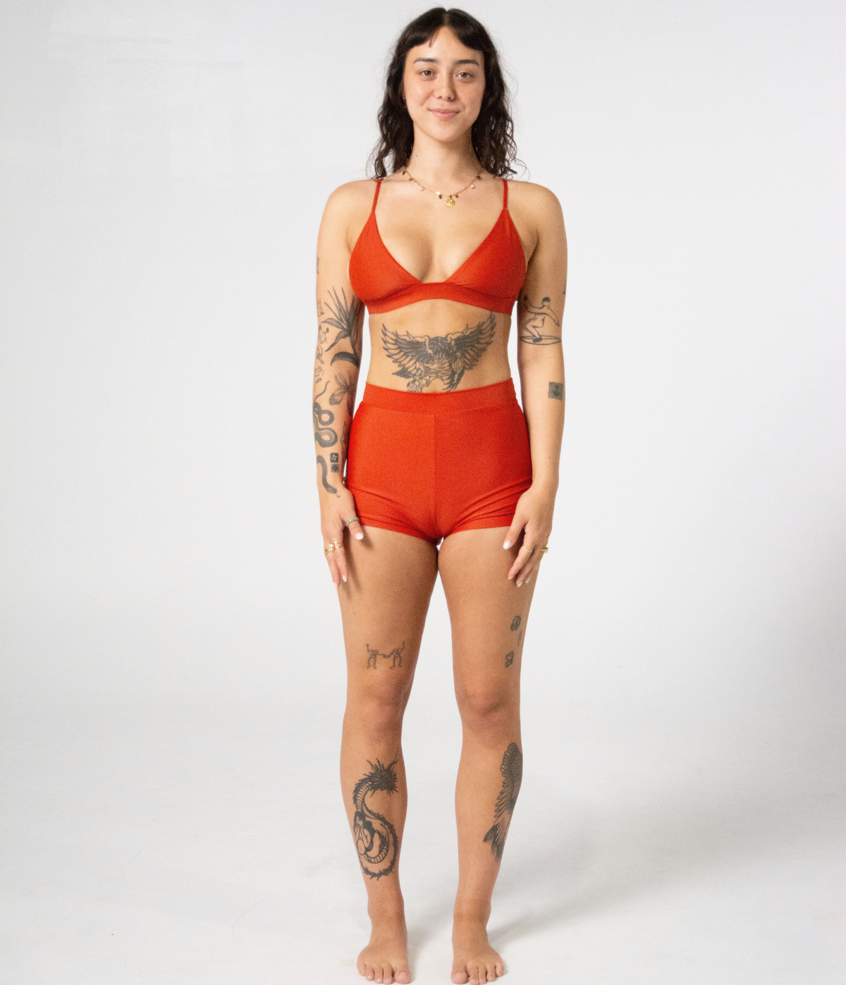 Kirra Triangle Top in Rust (orange), front view on model