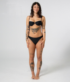 Wategos Underwire Top in Noir (black) worn with the Byron Low Rise Bottoms, front view on model
