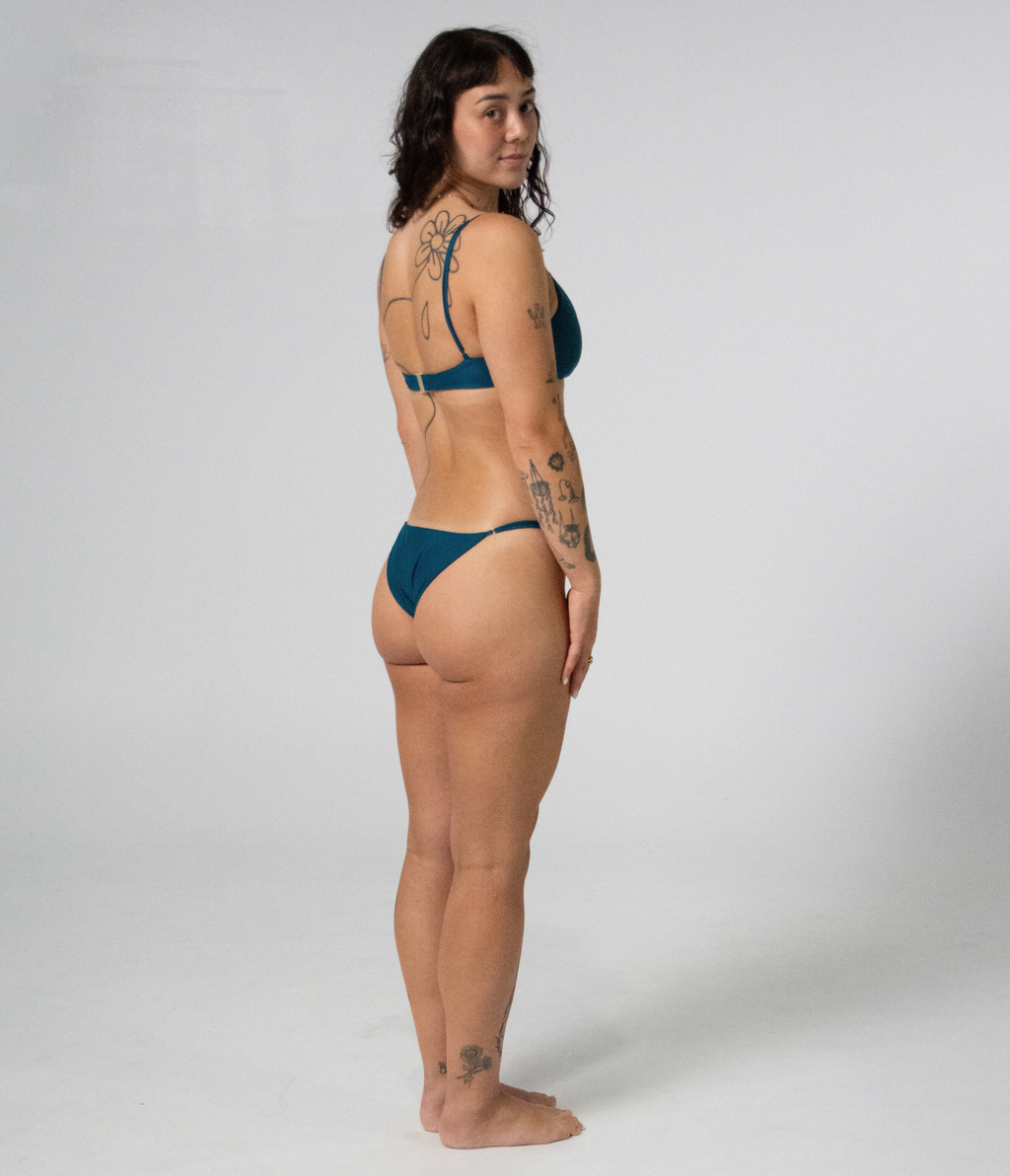Crescent Scoop Top in Peacock (teal), right side view on model