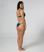 Crescent Scoop Top in Peacock (teal), right side view on model