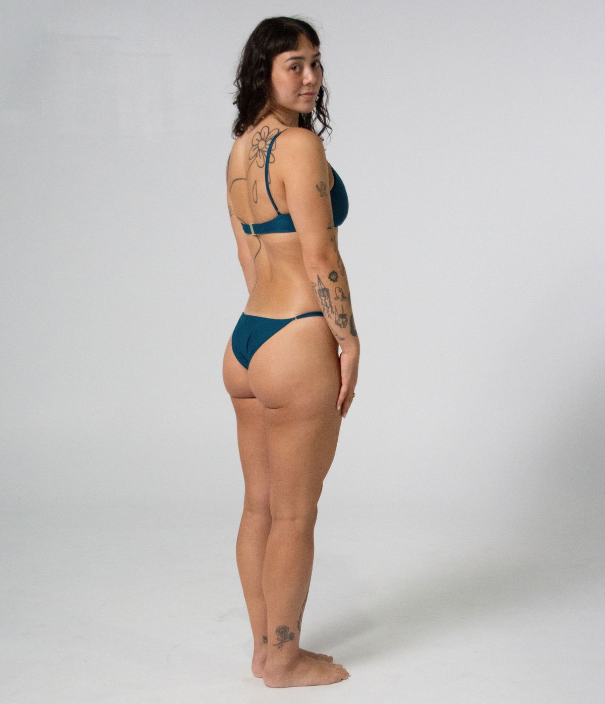 Crescent Scoop Top in Peacock (teal), right side view on model