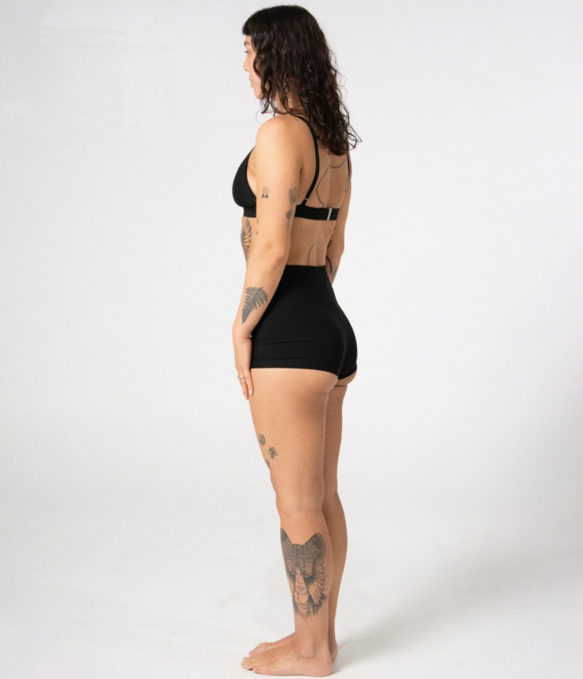 Kirra Triangle Top in Noir (black), left side view on model
